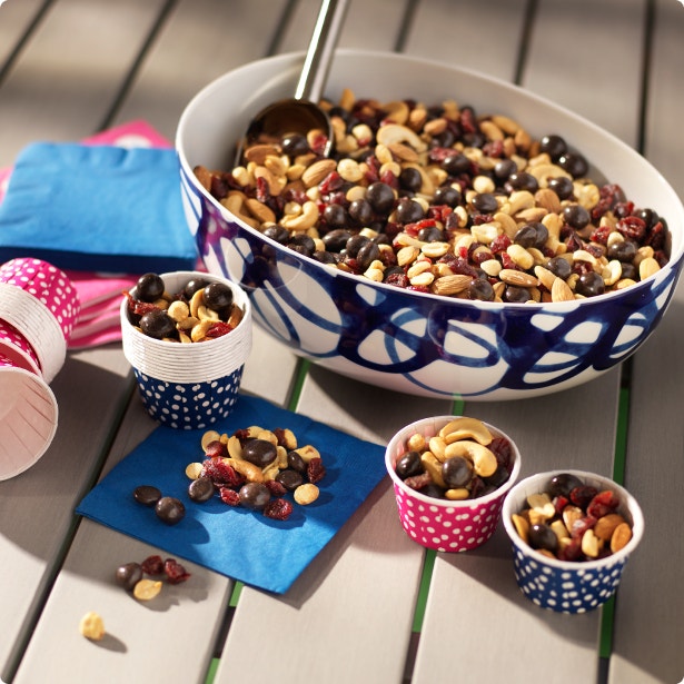 party sized bowl of trail mix with mini serving cups